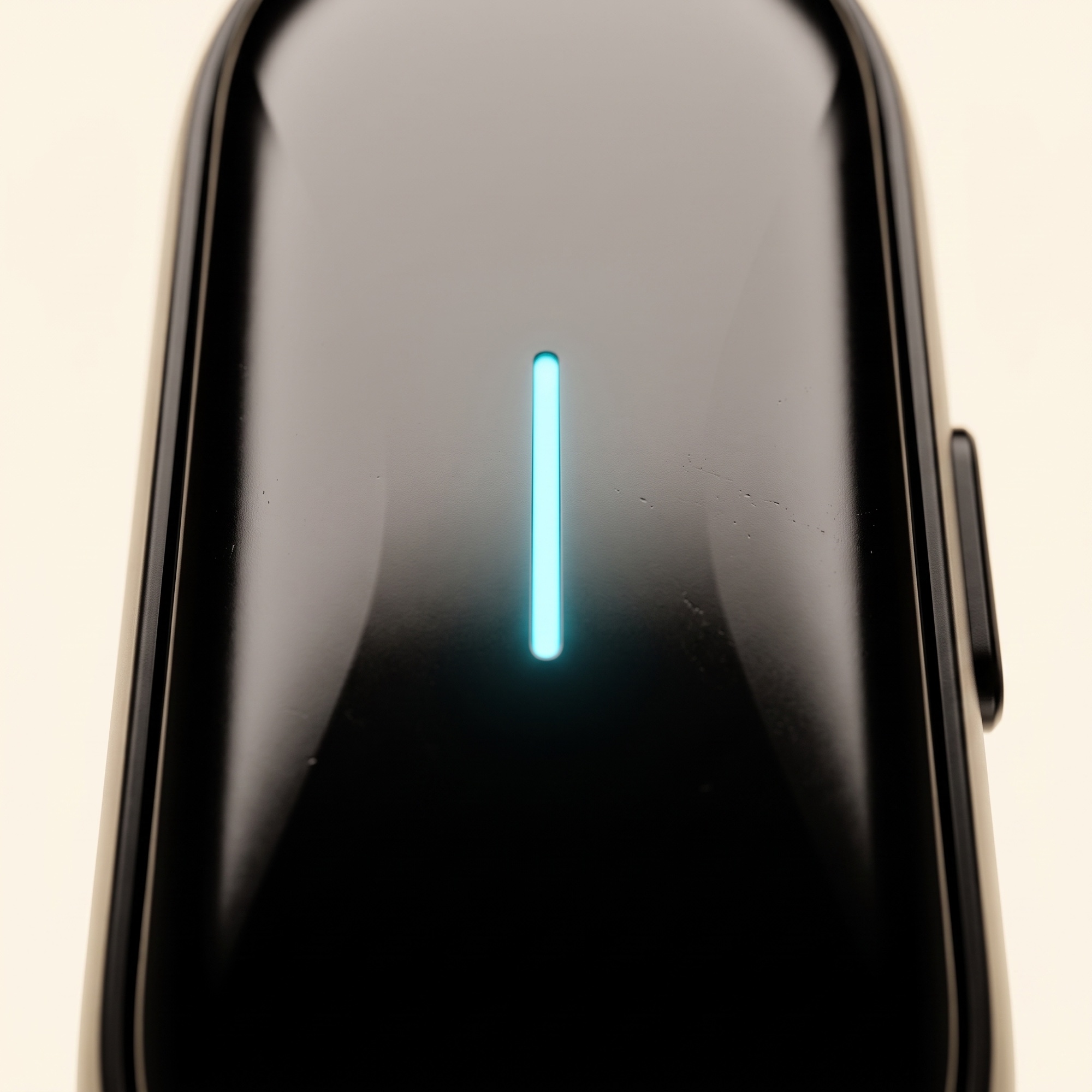 Extreme macro of the ONA device's front face, LED glowing
